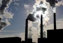 New modelling shows Australia can—and should—begin fossil fuel phase-out now Chimney smoke stacks from fossil fuels (IEA)