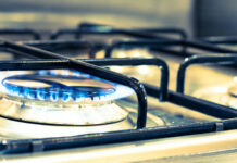 AEMC makes final rule on gas connection charges Gas stove with one burner lit (victoria)
