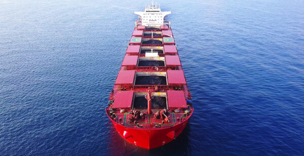 Coal ship at sea (fossil fuel)