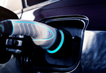 ARENA backs Australia’s largest commercial V2G deployment Close-up view of electric vehicle charging (calculator EV)