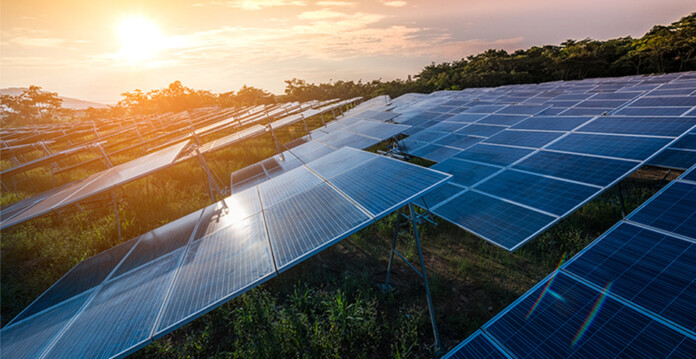 Solar farm at dawn with sun rising in the background (Glenrowan)