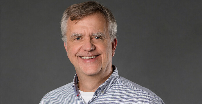 Headshot of smiling Dr Dietmar Tourbier