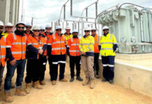 Hitachi Energy to deliver ElectraNet’s first SF₆-free switchgear ElectraNet workers in high-vis safety gear standing at Bundey Substation (electricity transformers)
