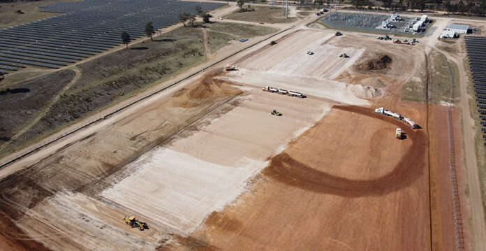 Aerial photo of dusty ground and construction at Neoen's Western Downs Battery site