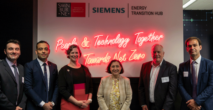 Swinburne-Energy-Hub Executives and Minister Lily D'Ambrosio standing in front of Energy Transition Hub signage