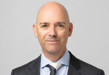 ARENA boss Darren Miller won’t seek fourth term as CEO Head and shoulders shot of a smiling Darren Miller wearing a suit and tie (ARENA)