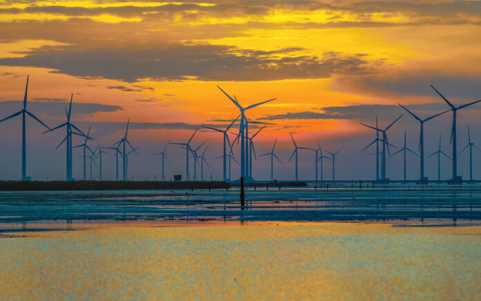 Offshore-wind-turbines-near-bac-lieu-city-south-vietnam-f Offshore wind turbines with beautiful sunset in the background