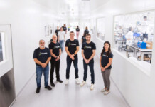 Hysata a national finalist for research commercialisation Hysata team members stand smiling in bright white office space
