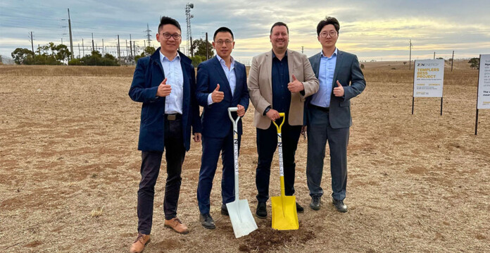 Sungrow and ZEN Energy executives in suits with shovels at site of Templers Battery project
