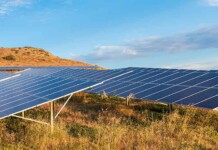 $100 million in funding to target ‘missing middle’ renewables solar panels sitting among grassy land in Australia