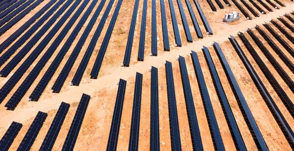 Solar panel arrays with red soil underneath