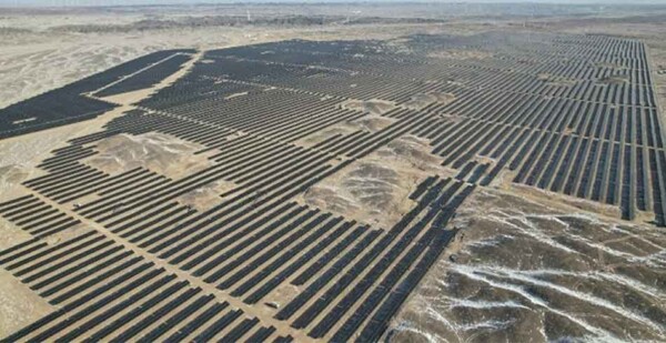 Aerial shot of solar arrays at Xinjiang Solar Project in the Gobi Desert, China
