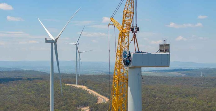Wind turbines being erected by crane at MacInture Wind Farm