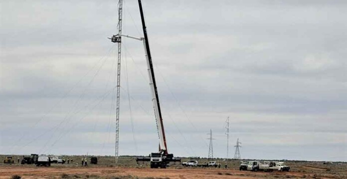 Crane erects emergency transmission tower near Broken Hill