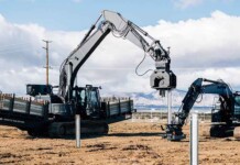Australia to manufacture army of solar-building robots Two construction robots working on a solar farm site