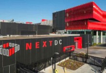 Australia data centre firm reports rising water, energy use External photo of the NEXTDC M2 Melbourne Data Centre with blue sky overhead