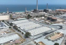 Synergy fined $1.2M for overpricing power from battery Aerial photo of massive second stage of Kwinana Battery in Western Australia
