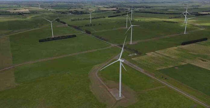 Aerial shot of wind turbines against green paddocks at Hawkesdale Wind Farm