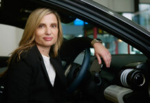 EV Council to drive National EV Charging Roadmap Smiling woman with blonde hair and black suit sits inside an electric vehicle