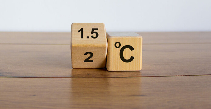 Wooden dice with 1.5 degrees Celsius tipping to 2 degrees Celsius