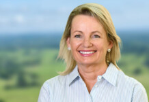 Sussan Ley appointed to Snowy Hydro Board Head and shoulders shot of smiling Sussan Ley, leader of the Liberal party, with green mountains and blue sky in the background