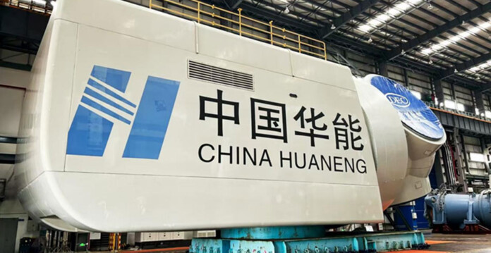 Massive offshore wind turbine in a factory with fluorescent lighting overhead