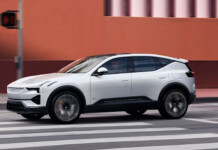 EV sales surge as demand grows amidst fuel crisis White Polestar 3 electric SUV driving on inner-city road