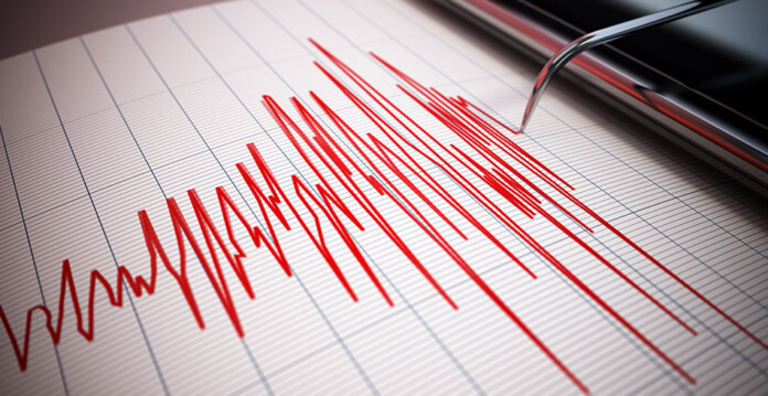 seismograph needle showing earthquake activity in red ink