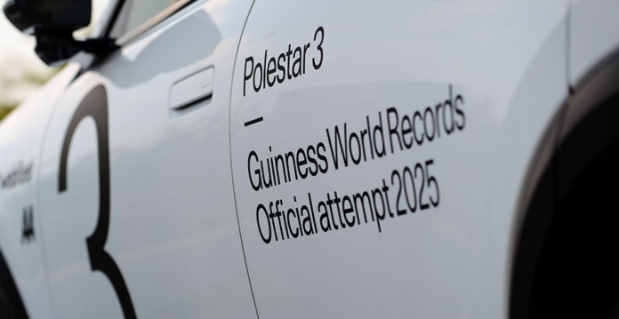 Close-up of rear passenger door of a white Polestar 3 Electric SUV with the words Polestar3 Guinness World Records Official Attempt 2025
