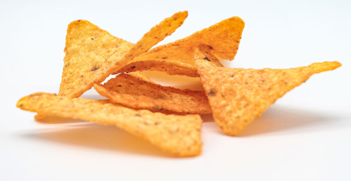 cluster of corn chips on a white surface