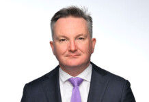 Bowen clashes with journalist over renewables transition Headshot of male wearing dark suit and purple tie