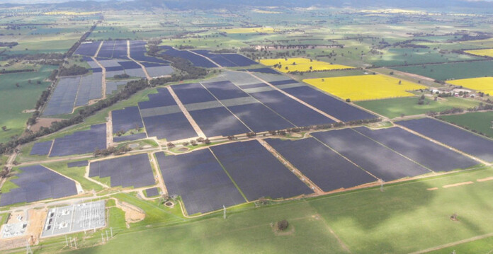 Aerial shot of solar arrays at large solar farm
