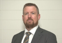 5 Minutes With: Global Power Energy’s Greg Elkins Head and shoulders shot of bearded man wearing a tie and dark grey suit