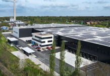 Supercharging with supercapacitors Rendered image of a massive factory in a leafy industrial area