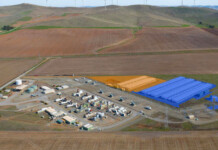 EnergyAustralia reaches financial close on Hallett Battery Rendered image of battery units at a battery project in a rural landscape