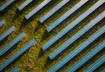 CleanPeak acquires Sustainable Energy Infrastructure Aerial shot of solar arrays at a solar farm