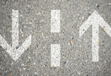 Negotiating the two-way grid Arrows printed on asphalt to depict a two-way street