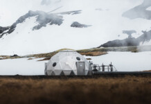 New CCS method permanently locks CO₂ into volcanic rocks CO2 storage dome in sparse landscape with snowy mountains in background