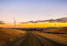 Iberdrola Australia acquires 242MW Ararat Wind Farm Wind turbines set in rural landscape with beautiful dusk sky overhead