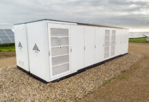 From battery-ready to hybrid by design: Why the connection queue is shifting White battery energy storage system with solar farm in background