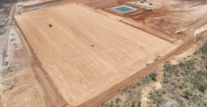 Aerial shot of a large bulldozed parcel of land at a mining site