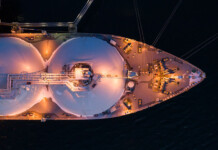 How a windfall LNG export tax can benefit all Australians Aerial shot of the front half of an LNG tanker at sea