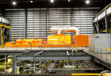Major overhaul of Unit C4 begins at Callide Power Station Large orange coal-fired turbine in massive turbine hall