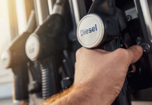 How Australia can beat the big diesel squeeze Male hand holds diesel fuel pump at bowser