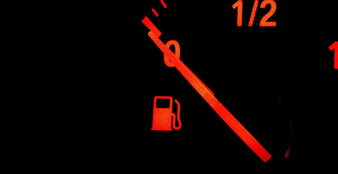 Close-up of illuminated fuel gauge on empty