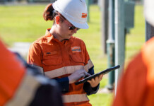 Essential Energy 2027 Graduate Program now open Group of energy workers, with focus on female worker in high-vis workgear and hard hat
