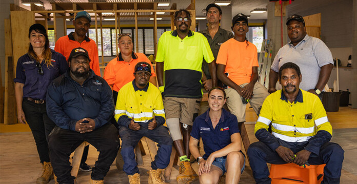A group of First Nations trainees pose for a photo