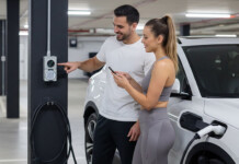ReadySteadyPlug scores $1.51M for strata EV charging Man and woman look at EV charging point in apartment building parking garage with white electric vehicle