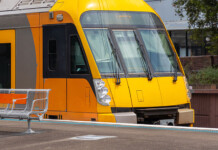 Snowy Hydro inks power supply deal for NSW transport yellow commuter train arrives at station platform