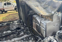 Vandals spark fire at substation, leaving Tasmanians in cold Charred substation equipment with a work vehicle in the background